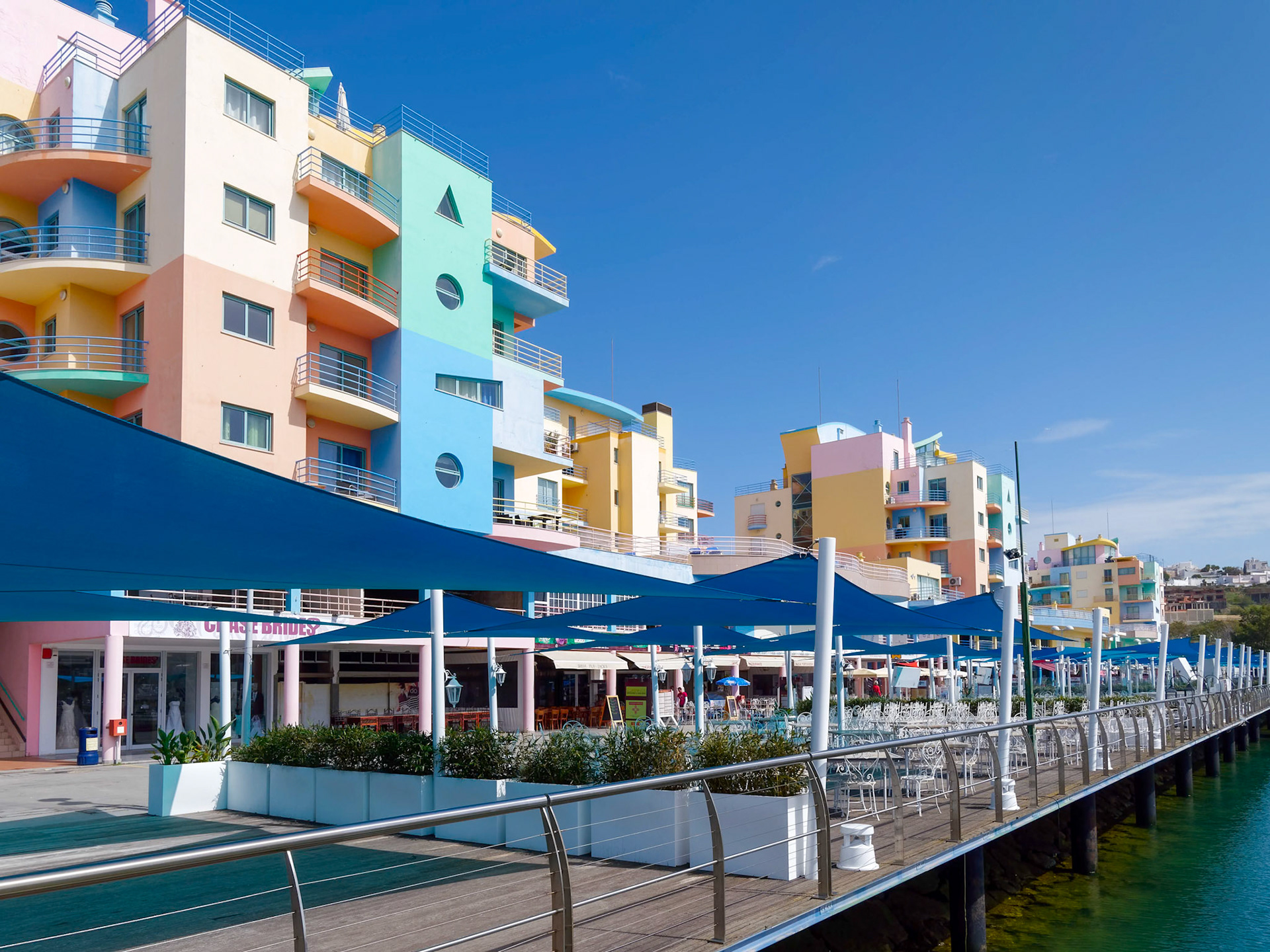 ALBUFEIRA, SOUTHERN ALGARVE/PORTUGAL - MARCH 10 : Colourful Buildings at the Marina in Albufeira Portugal on March 10, 2018 Unidentified people
