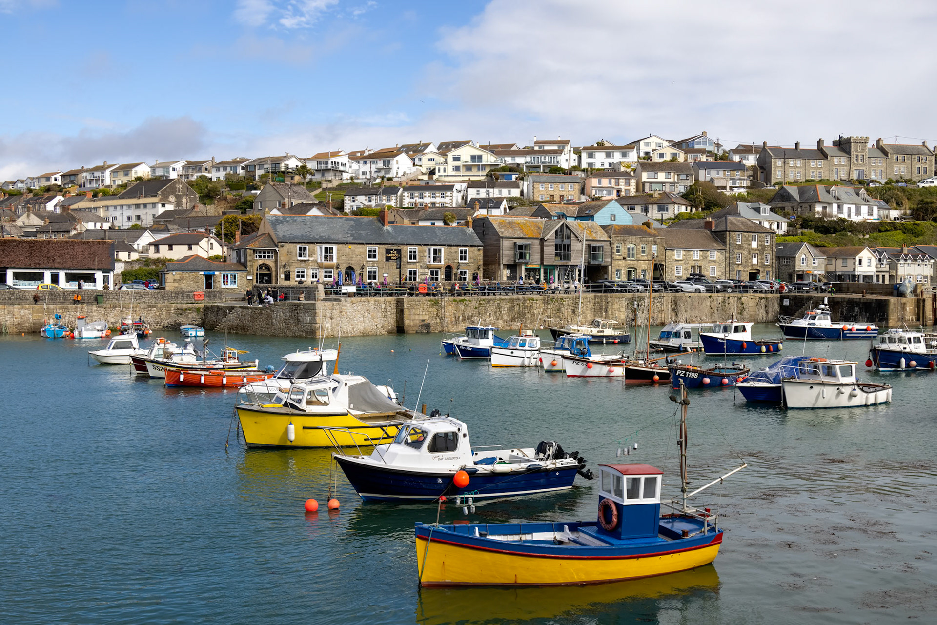 PORTHLEVEN, CORNWALL, UK - MAY 11 : View of the town and harbour in Porthleven, Cornwall on May 11, 2021. Unidentified people