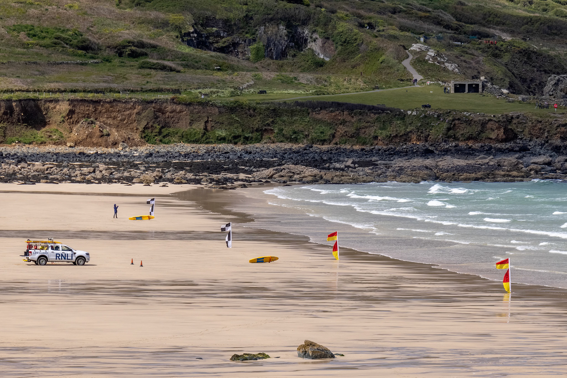 ST IVES, CORNWALL, UK - MAY 13 : View of Porthmeor beach at St Ives, Cornwall on May 13, 2021. Unidentified people