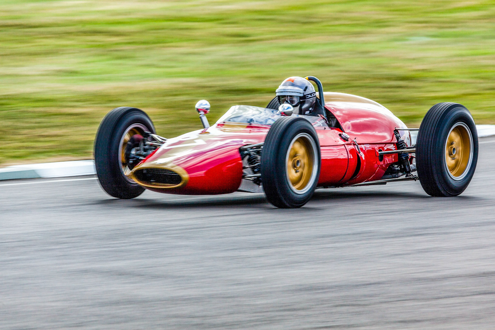 GOODWOOD, WEST SUSSEX/UK - SEPTEMBER 14 : Vintage Racing at Goodwood West Sussex on September 14, 2012. One unidentified person